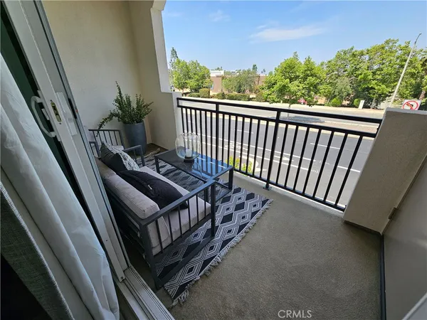 a view of a balcony with wooden floor