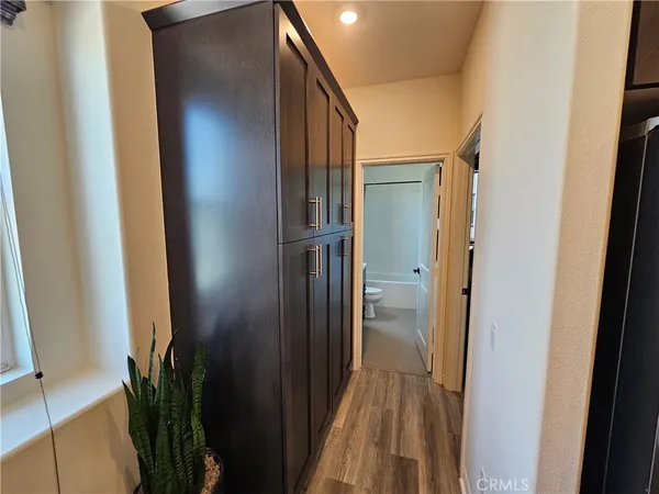 a view of a room with wooden floor