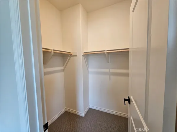 a view of a hallway with paintings on the wall