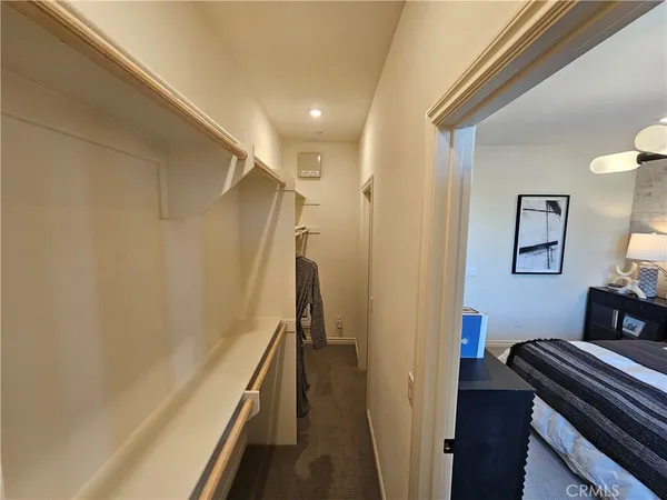 a view of a hallway with stairs