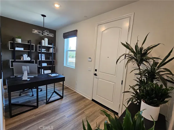 a view of a workspace with furniture