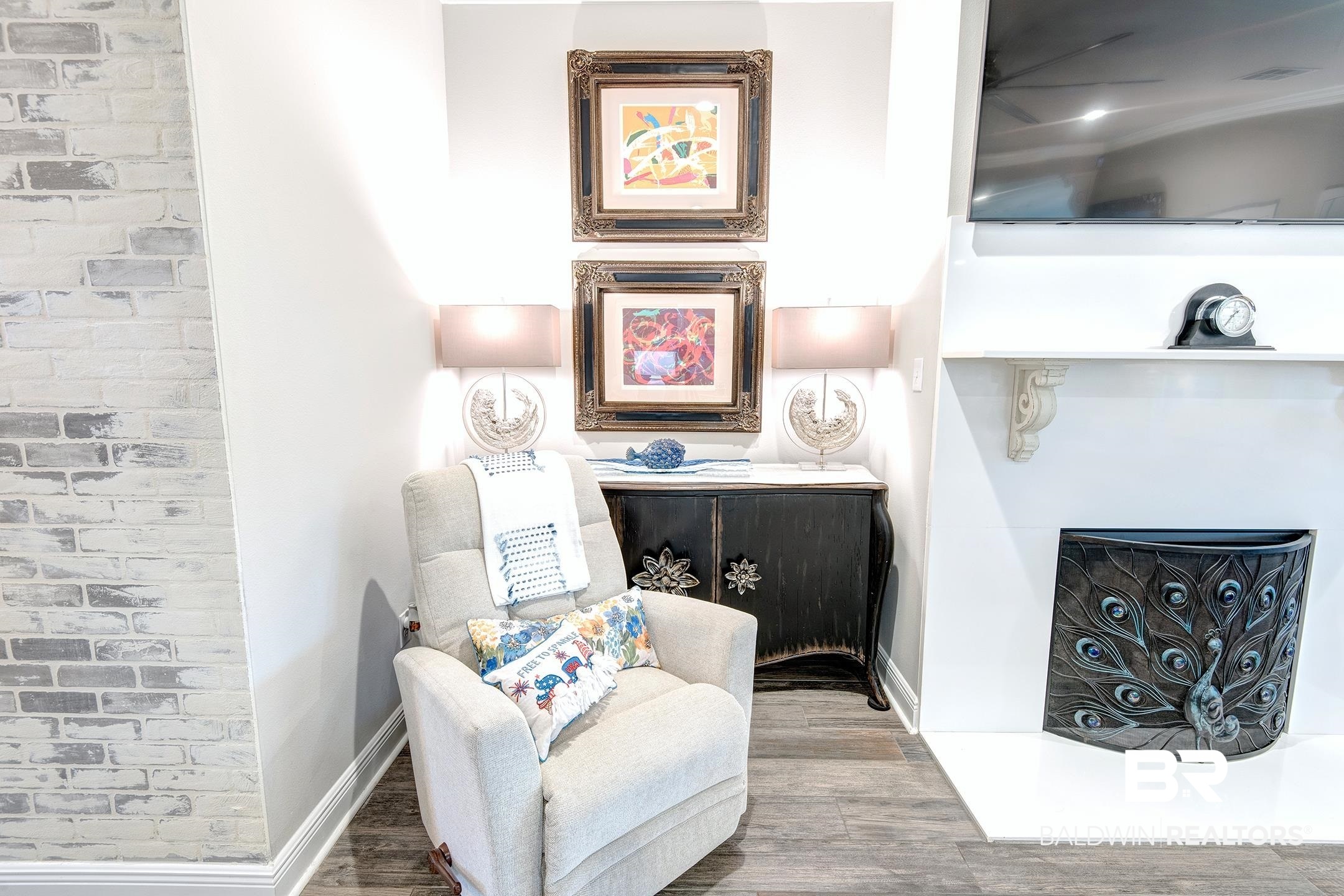 9988 Dunleith Loop Daphne, AL 36526 - Photo 27 of 51 Sitting room featuring hardwood / wood-style floors and brick wall