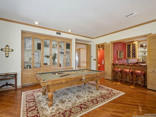 a spacious bathroom with a granite countertop sink mirror and shower