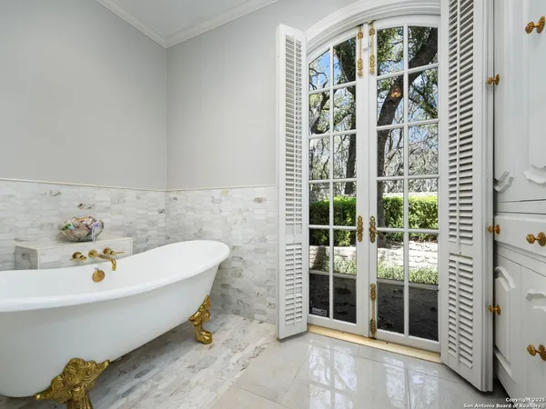 a bathroom with a sink vanity and mirror