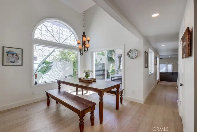 a view of a livingroom with furniture window and wooden floor