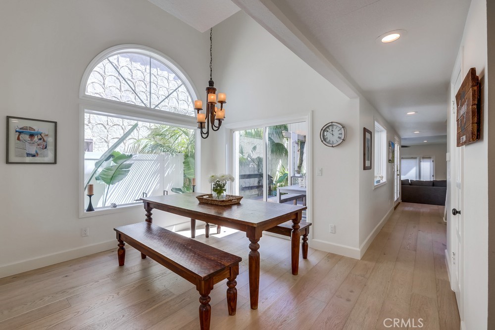 225 20th Street Huntington Beach, CA 92648 - Photo 18 of 47 a view of a livingroom with furniture window and wooden floor