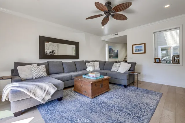 a living room with furniture and a rug