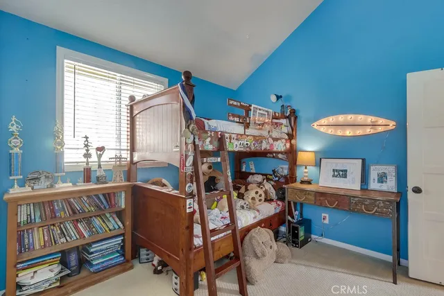 a bedroom with furniture and a window