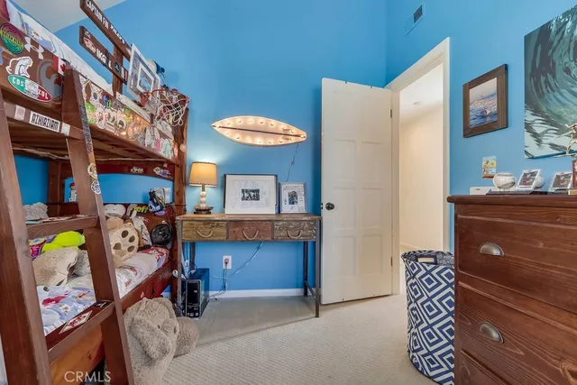 a view of living room with furniture and a chandelier