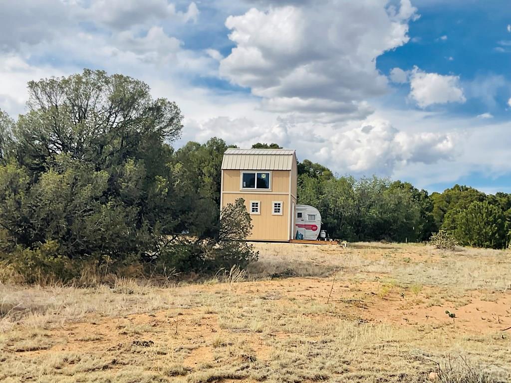 Lot 17 Navajo Ranch Walsenburg, CO 81089 - Photo 8 of 26 a front view of a house with a yard