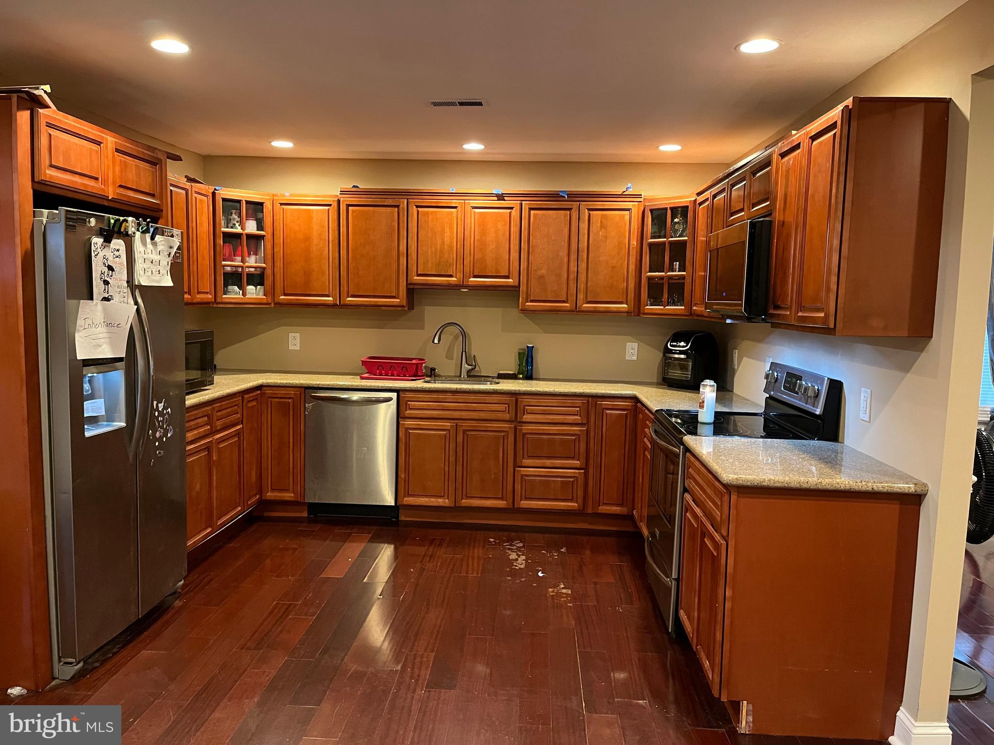 64 Indian Park Road Levittown, PA 19057 - Photo 9 of 34 Wood cabinets, stainless steel appliances