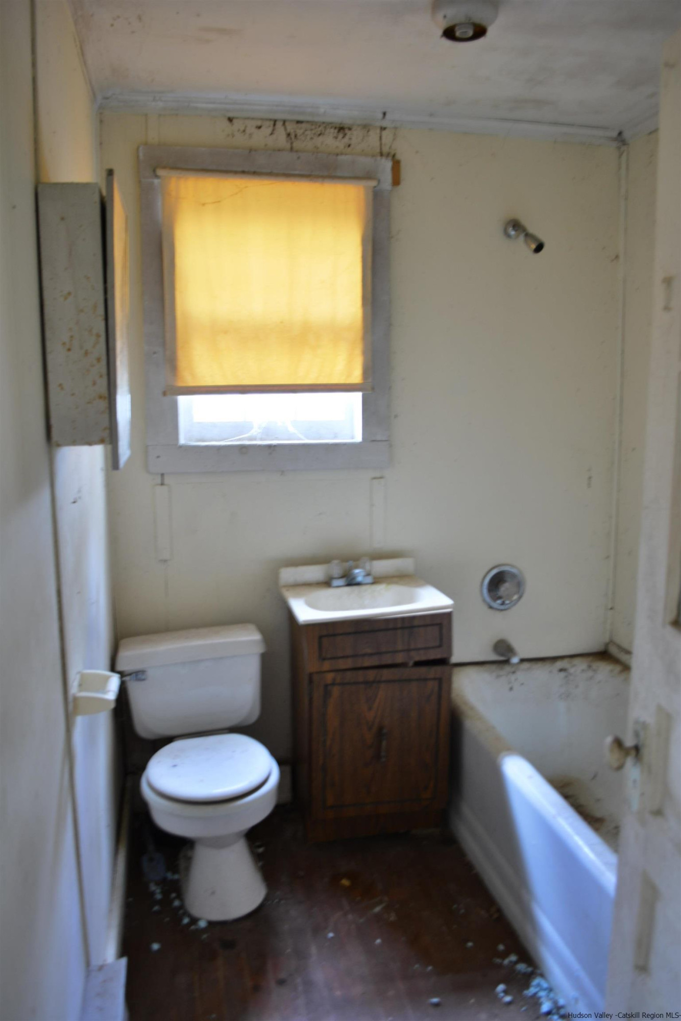 345 Towpath Road Accord, NY 12404 - Photo 17 of 35 a bathroom with a toilet a sink and a window