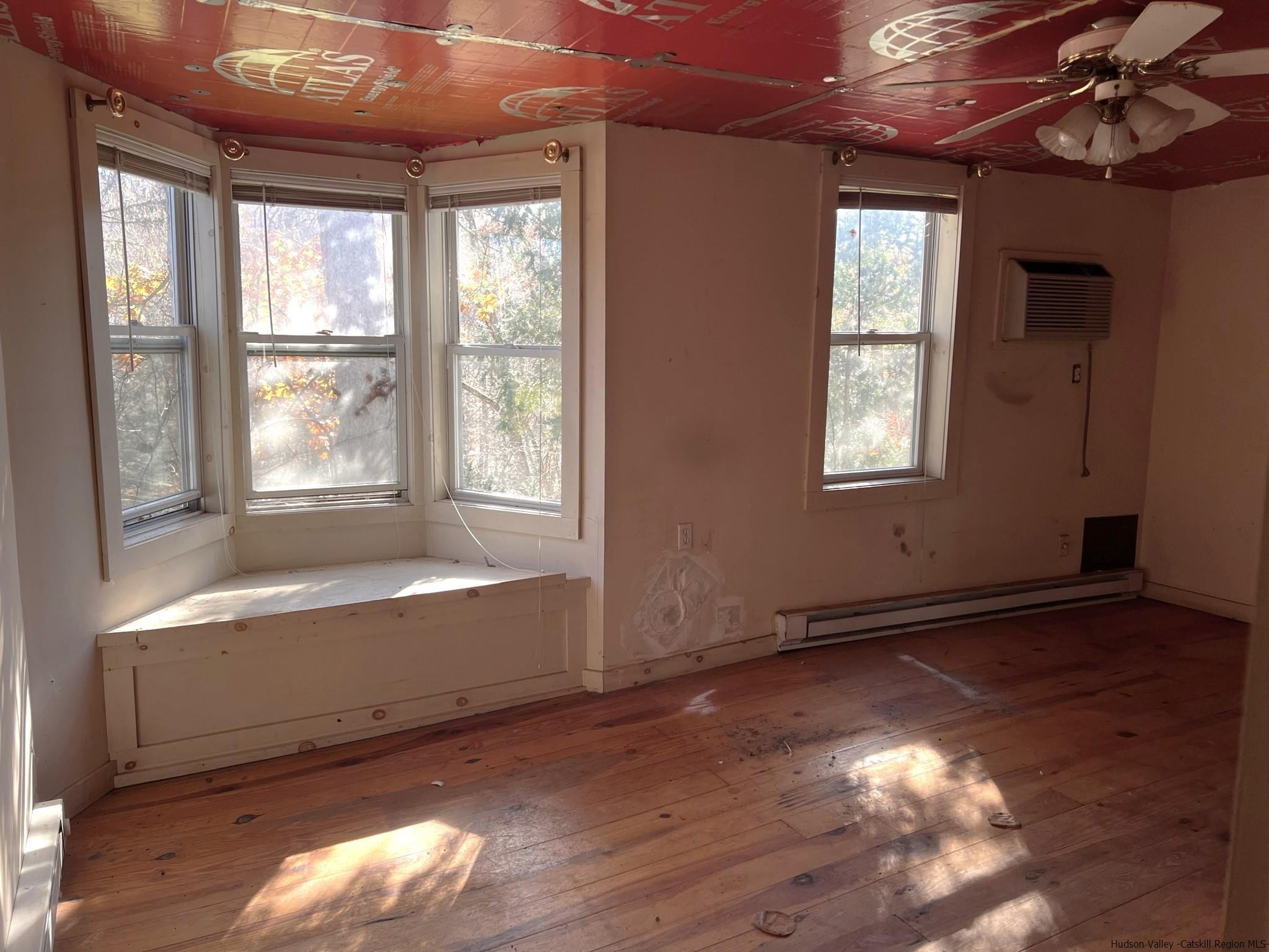 345 Towpath Road Accord, NY 12404 - Photo 28 of 35 a view of an empty room with wooden floor and a window