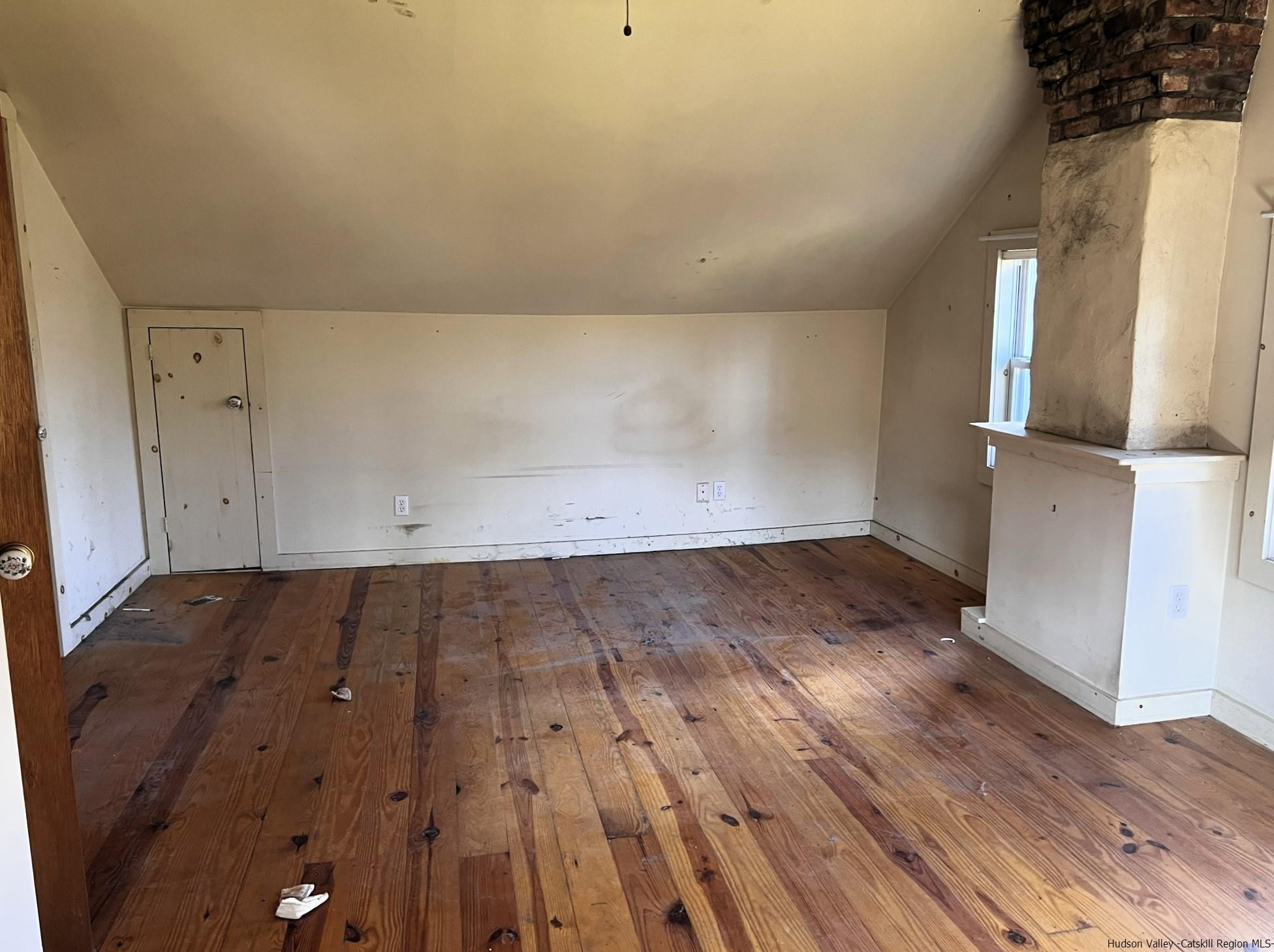 345 Towpath Road Accord, NY 12404 - Photo 30 of 35 an empty room with wooden floor and cabinet