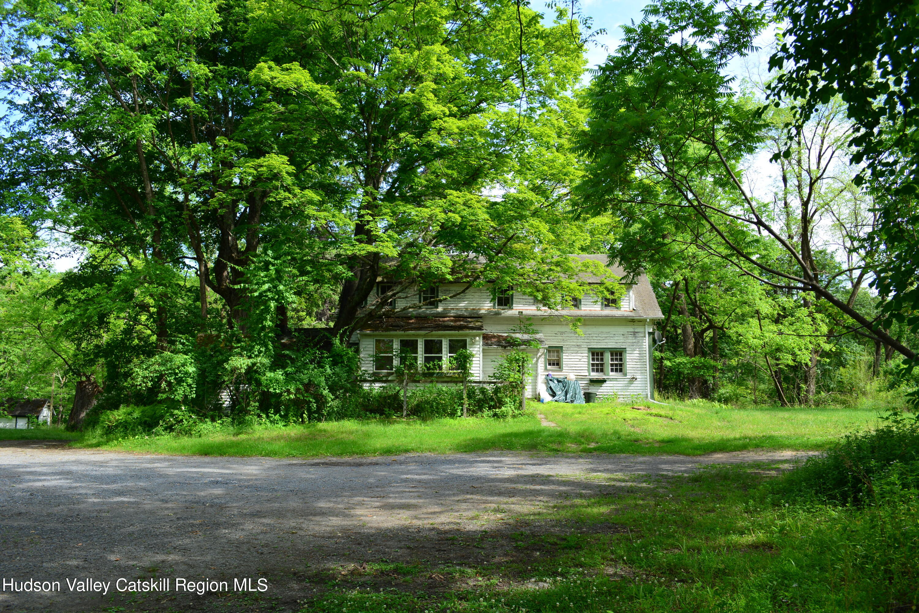 345 Towpath Road Accord, NY 12404 - Photo 10 of 35 a front view of a house with a garden