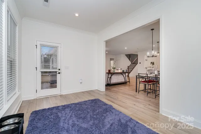 a view of a livingroom with furniture and wooden floor
