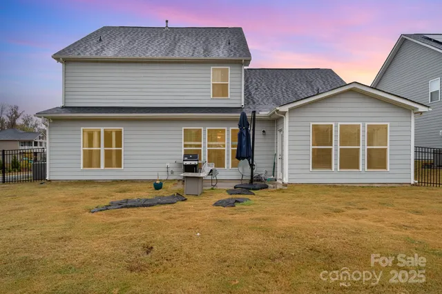 a front view of a house with a garden and patio