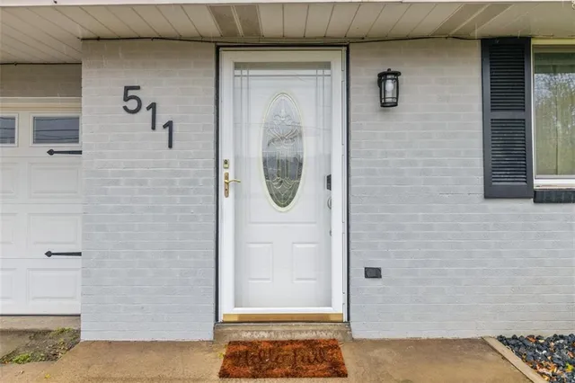 a bathroom with a glass door shower