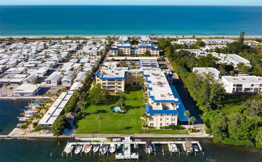 3808 Gulf Of Mexico Drive, Unit E211 Longboat Key, FL 34228 - Photo 1 of 34 an aerial view of multiple house