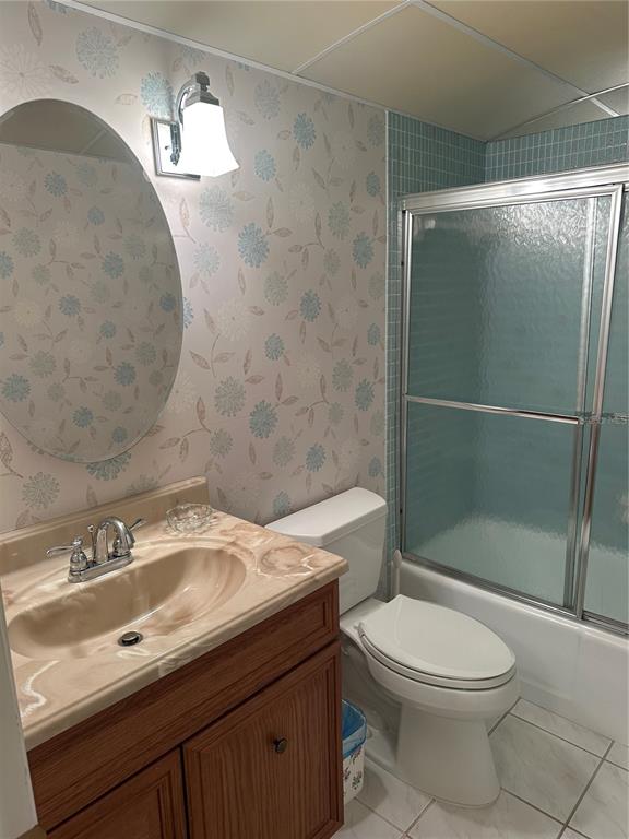 3808 Gulf Of Mexico Drive, Unit E211 Longboat Key, FL 34228 - Photo 22 of 34 a bathroom with a sink toilet and shower