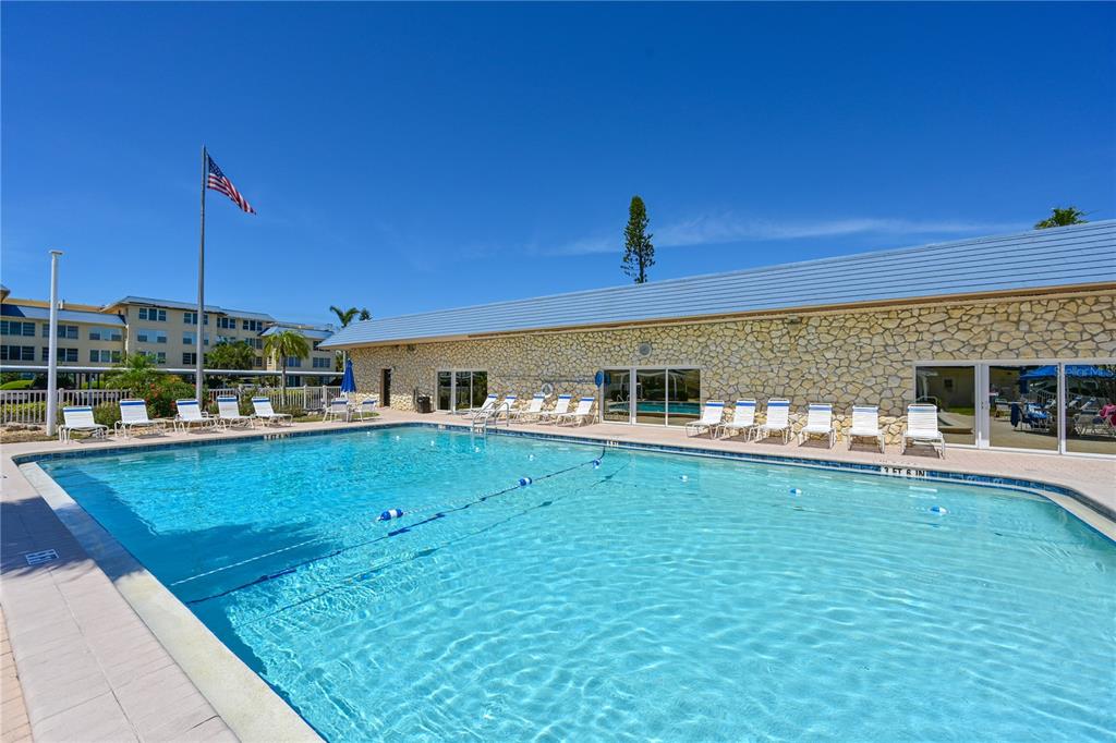 3808 Gulf Of Mexico Drive, Unit E211 Longboat Key, FL 34228 - Photo 28 of 34 a view of a living room and kitchen