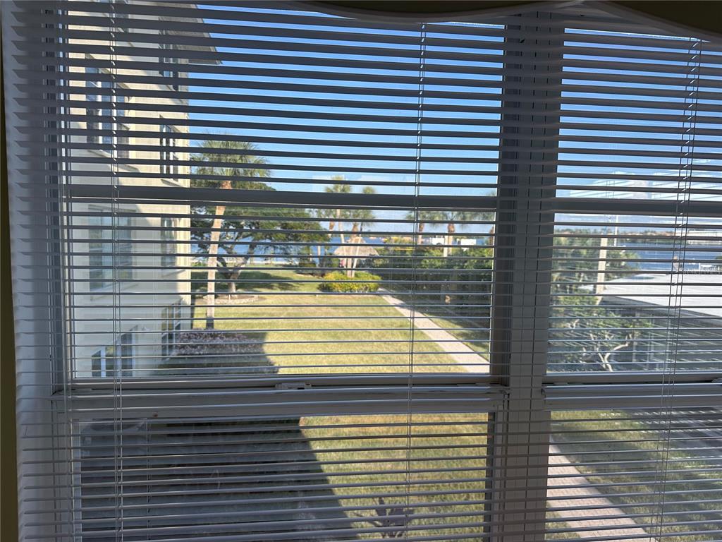 3808 Gulf Of Mexico Drive, Unit E211 Longboat Key, FL 34228 - Photo 7 of 34 a view of a balcony with a door