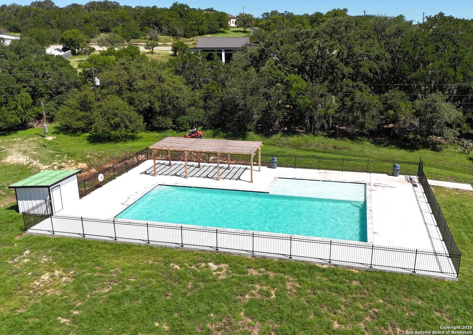 815 Winding River Lane Spring Branch, TX 78070 - Photo 5 of 9 a view of yard with swimming pool and green space
