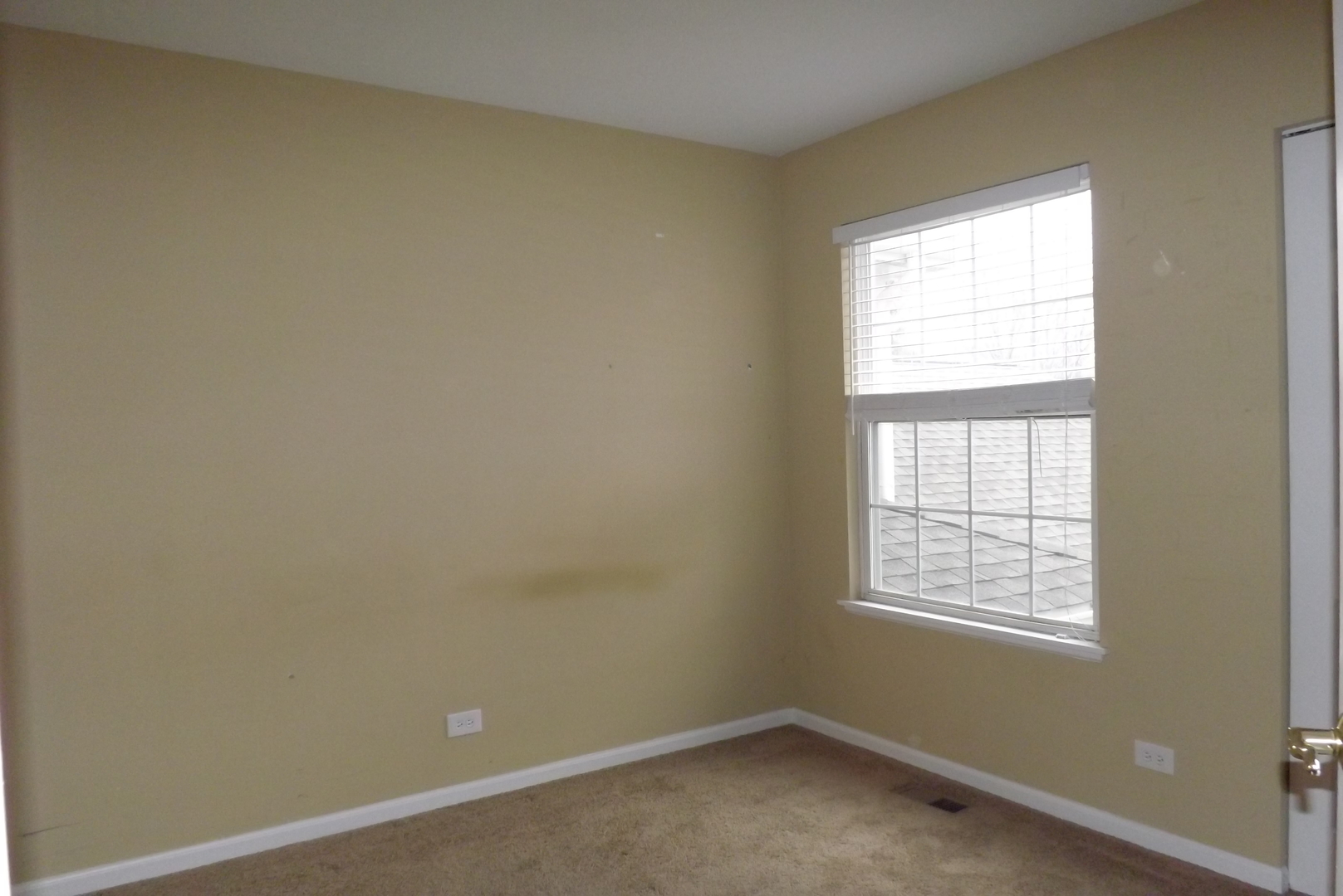 1078 Stillwater Road Elgin, IL 60120 - Photo 13 of 13 an empty room with a window