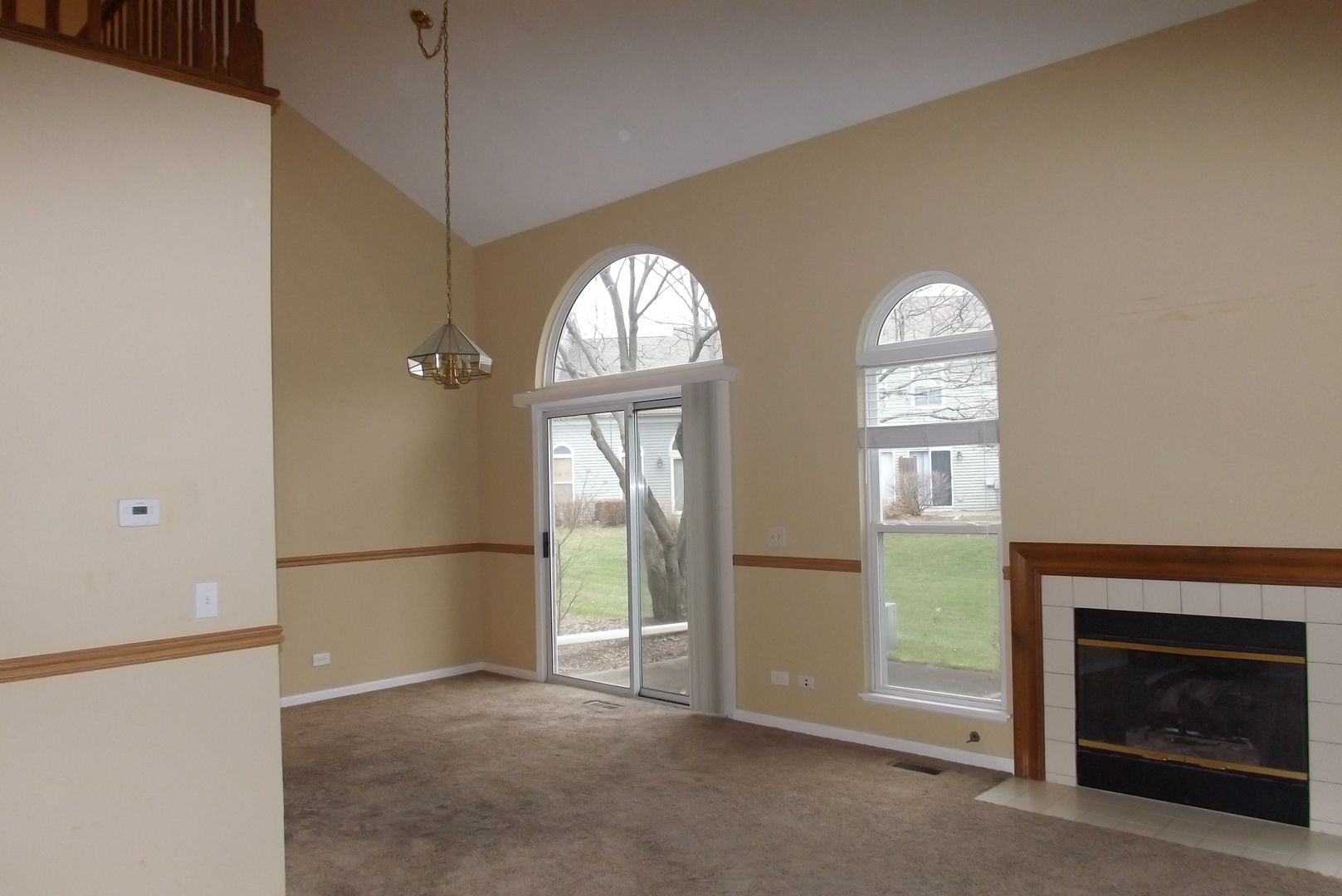 1078 Stillwater Road Elgin, IL 60120 - Photo 4 of 13 a view of empty room with a fireplace and window