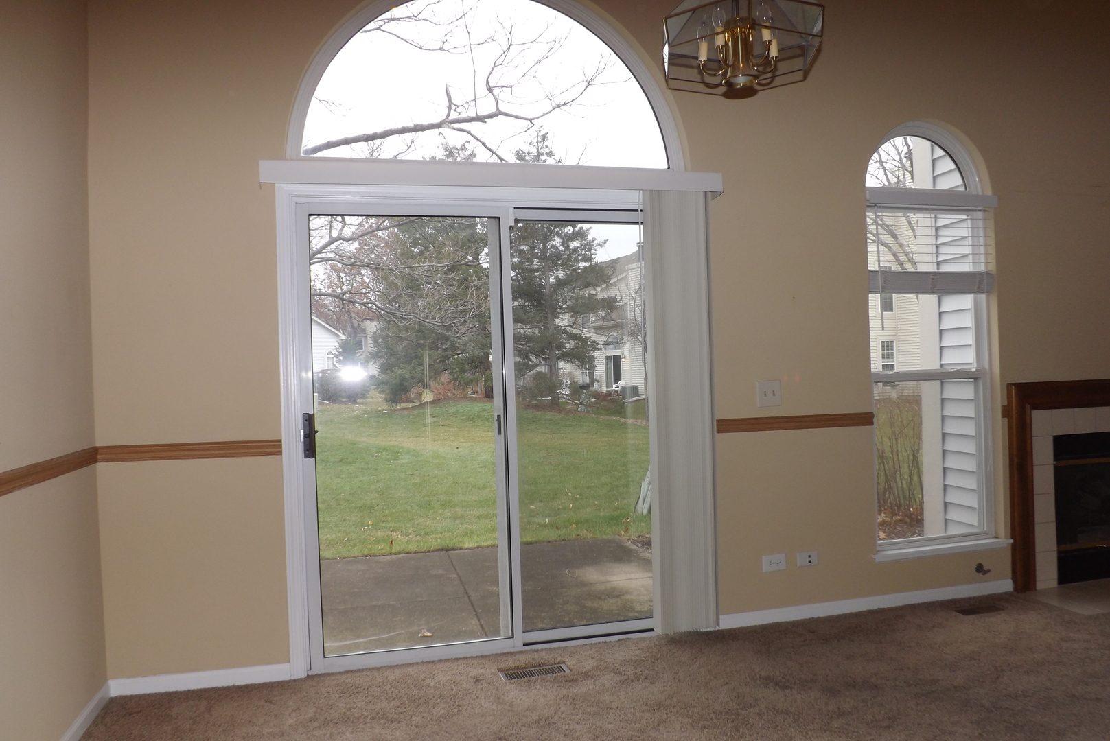 1078 Stillwater Road Elgin, IL 60120 - Photo 8 of 13 an empty room with windows view and front door