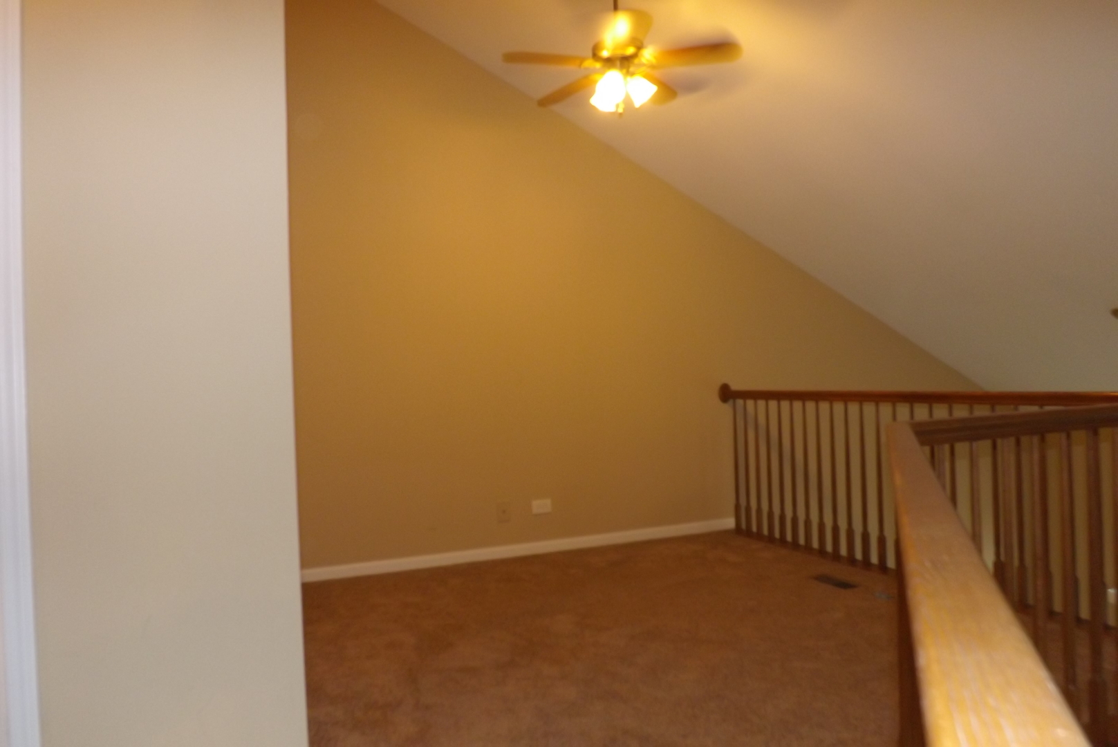 1078 Stillwater Road Elgin, IL 60120 - Photo 10 of 13 a view of a room with a ceiling fan and carpet