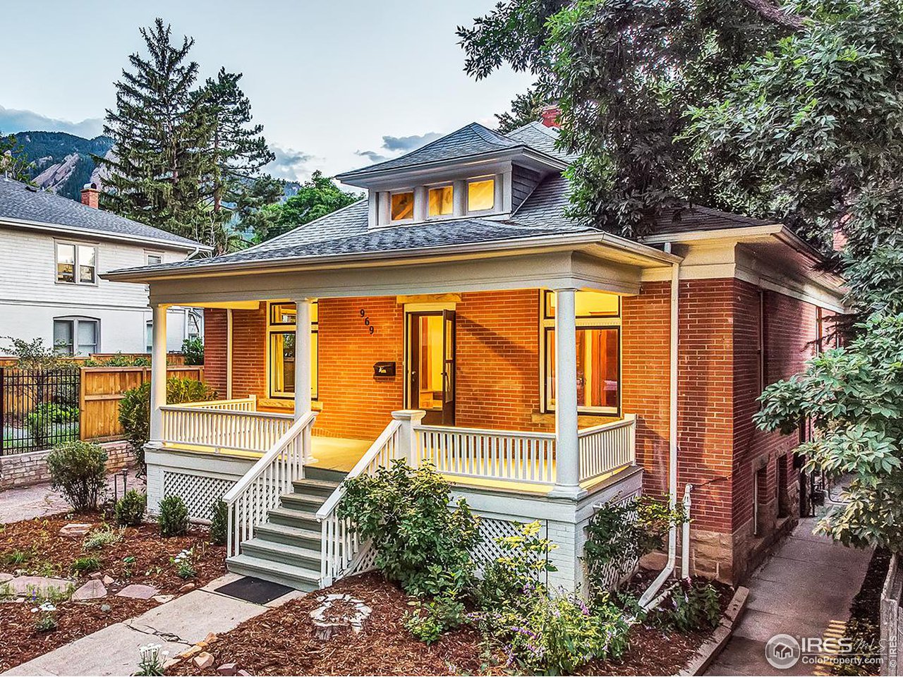 969 10th Street Boulder, CO 80302 - Photo 1 of 40 a front view of a house with a porch