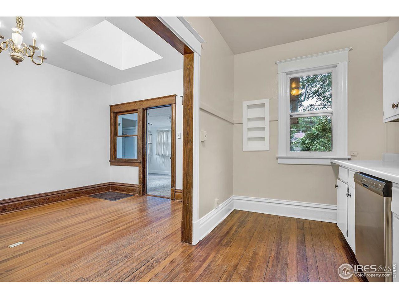969 10th Street Boulder, CO 80302 - Photo 17 of 40 wooden floor in an empty room with a window