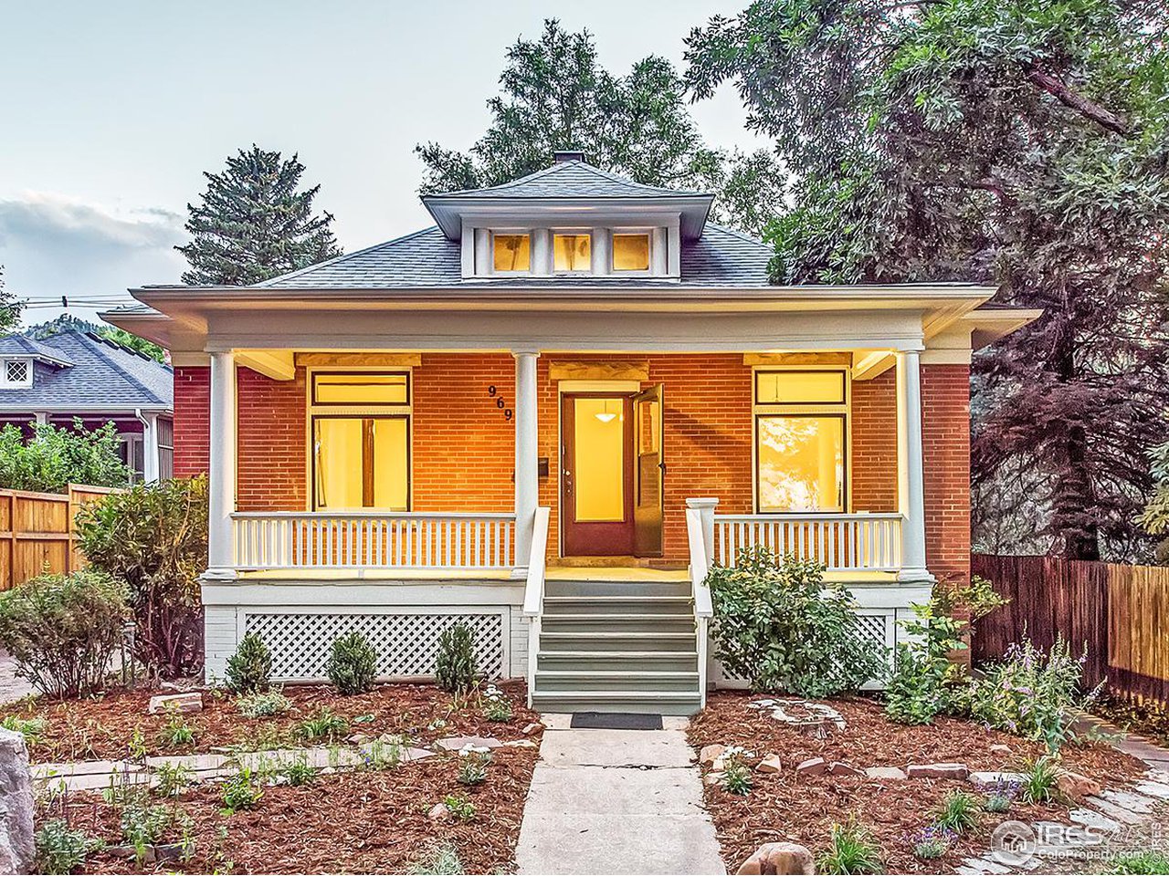 969 10th Street Boulder, CO 80302 - Photo 2 of 40 a front view of a house with a garden
