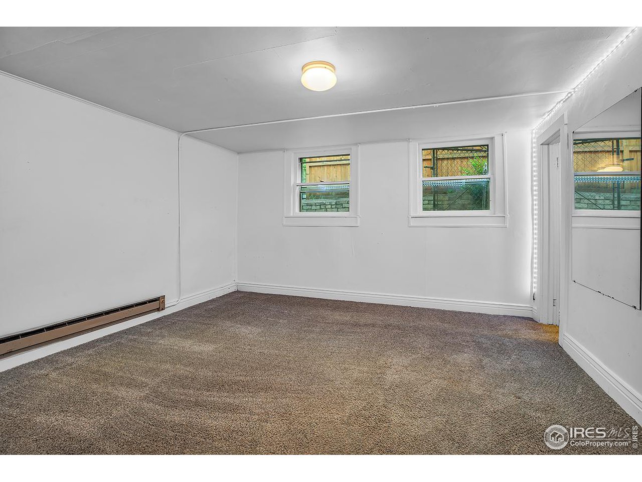 969 10th Street Boulder, CO 80302 - Photo 26 of 40 a view of an empty room with a window