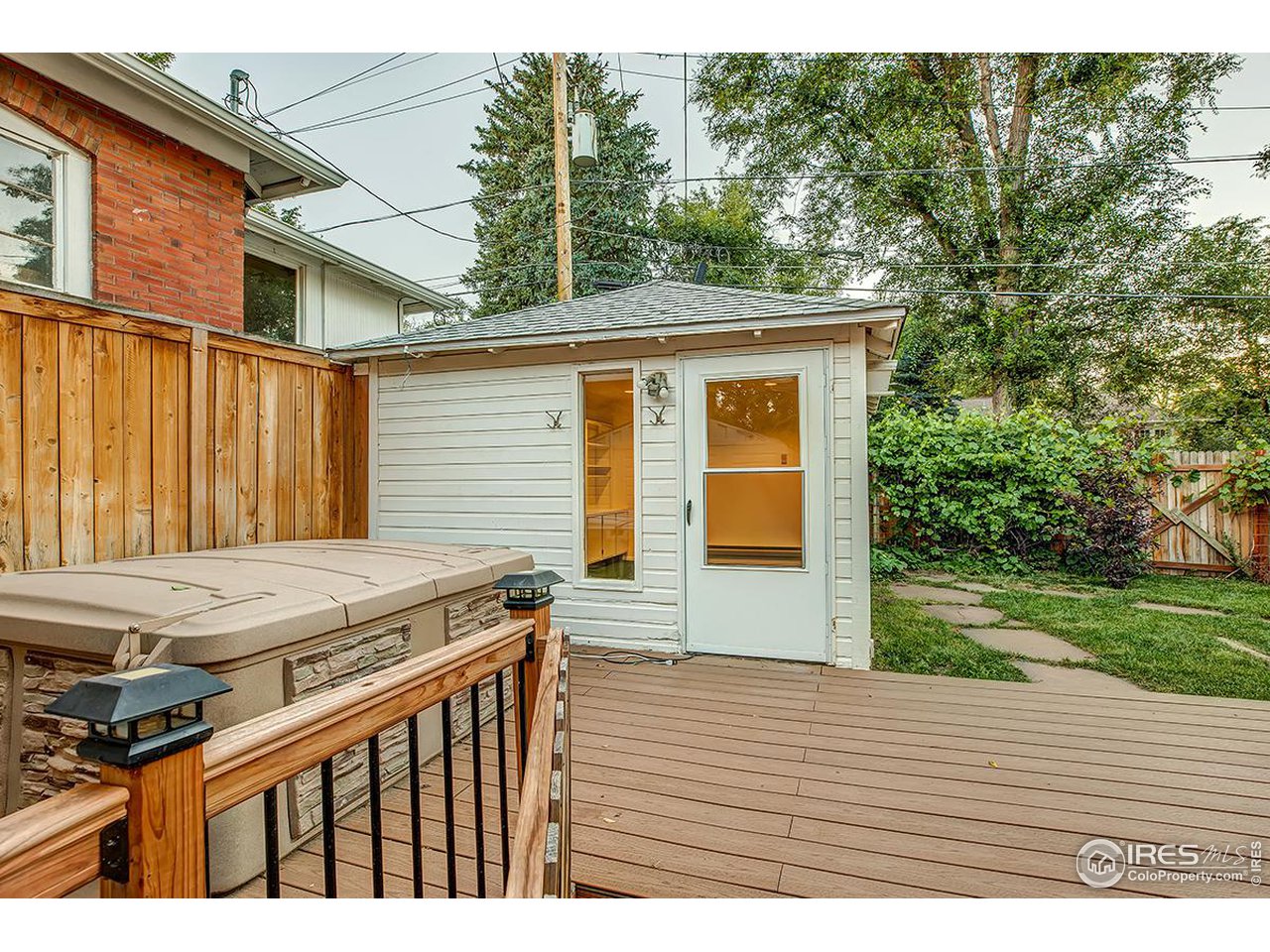969 10th Street Boulder, CO 80302 - Photo 31 of 40 a view of a wooden deck and a yard