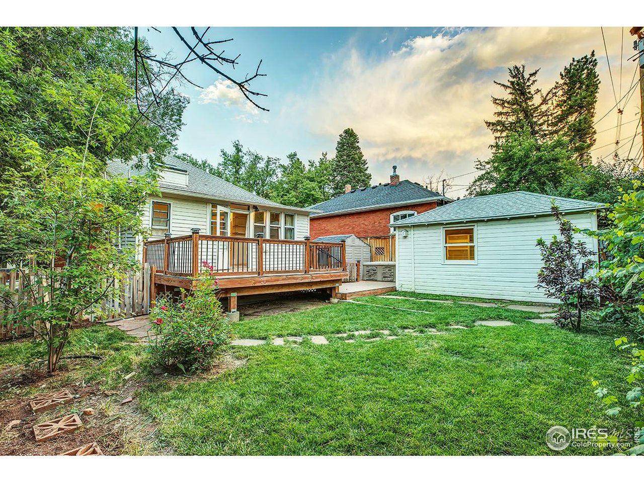 969 10th Street Boulder, CO 80302 - Photo 33 of 40 a backyard of a house with wooden floor and fence