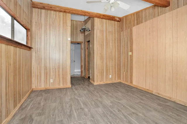 a view of a room with wooden walls