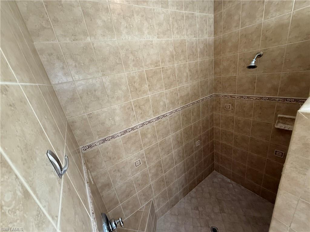 10228 Cobble Hill Road Bonita Springs, FL 34135 - Photo 14 of 31 Bathroom featuring tiled shower