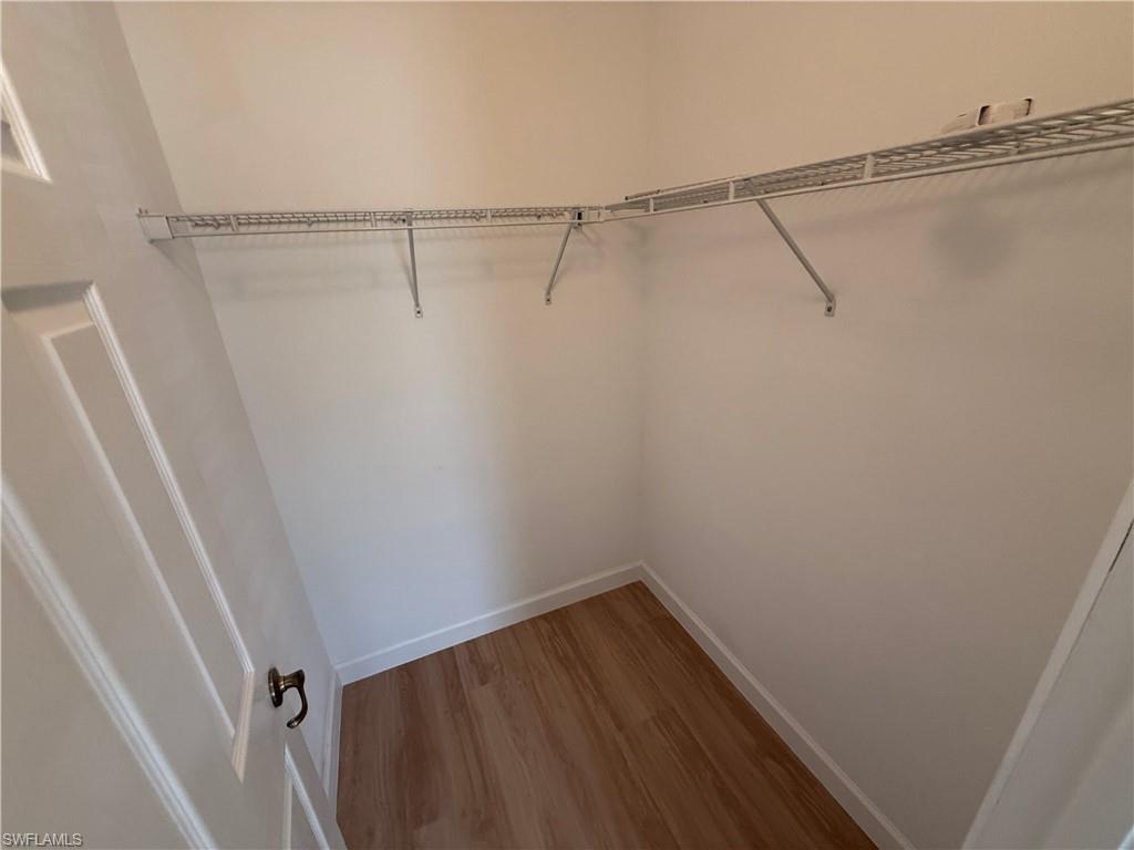 10228 Cobble Hill Road Bonita Springs, FL 34135 - Photo 20 of 31 Walk in closet with light wood-type flooring
