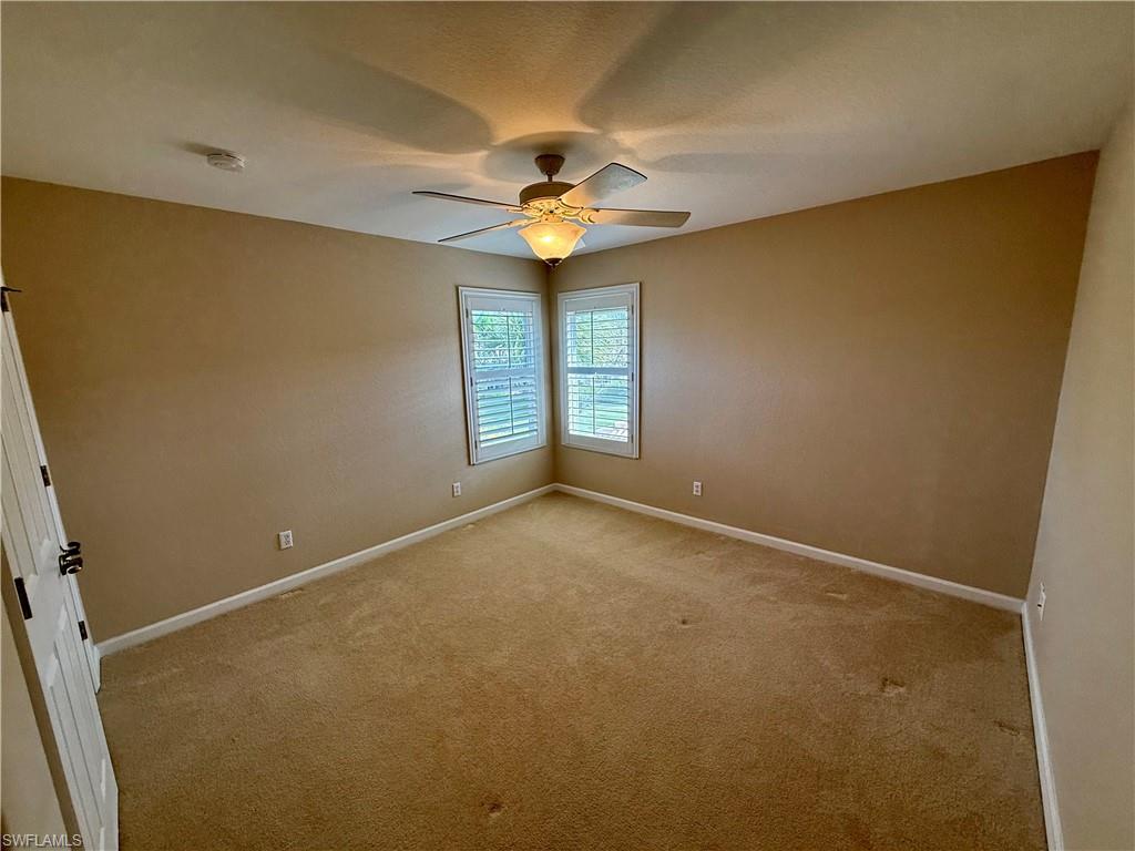 10228 Cobble Hill Road Bonita Springs, FL 34135 - Photo 21 of 31 Unfurnished room with carpet floors and ceiling fan