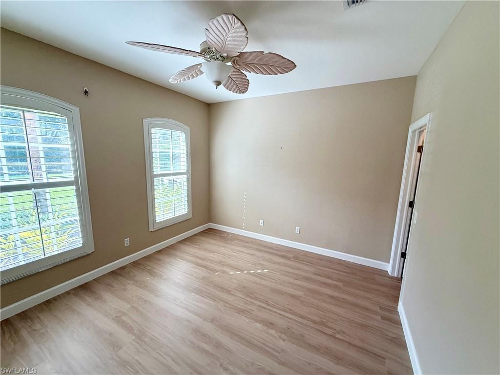 10228 Cobble Hill Road Bonita Springs, FL 34135 - Photo 22 of 31 Spare room featuring light wood-style flooring and ceiling fan