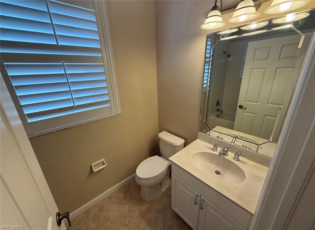 10228 Cobble Hill Road Bonita Springs, FL 34135 - Photo 27 of 31 Bathroom with vanity, shower / tub combination, and light tile patterned floors