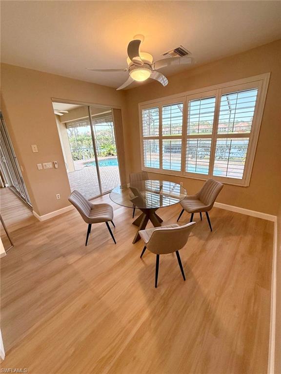 10228 Cobble Hill Road Bonita Springs, FL 34135 - Photo 3 of 31 Living area featuring ceiling fan and light wood-style floors