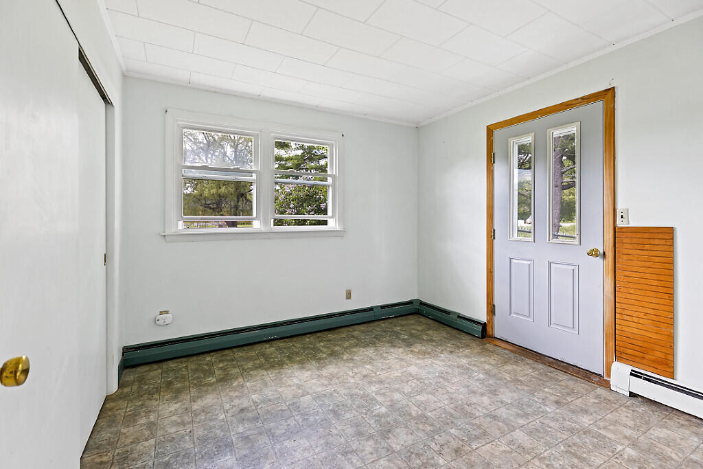 2525 West River Road Sidney, ME 04330 - Photo 11 of 41 Bedroom 2 door leads to fenced yard