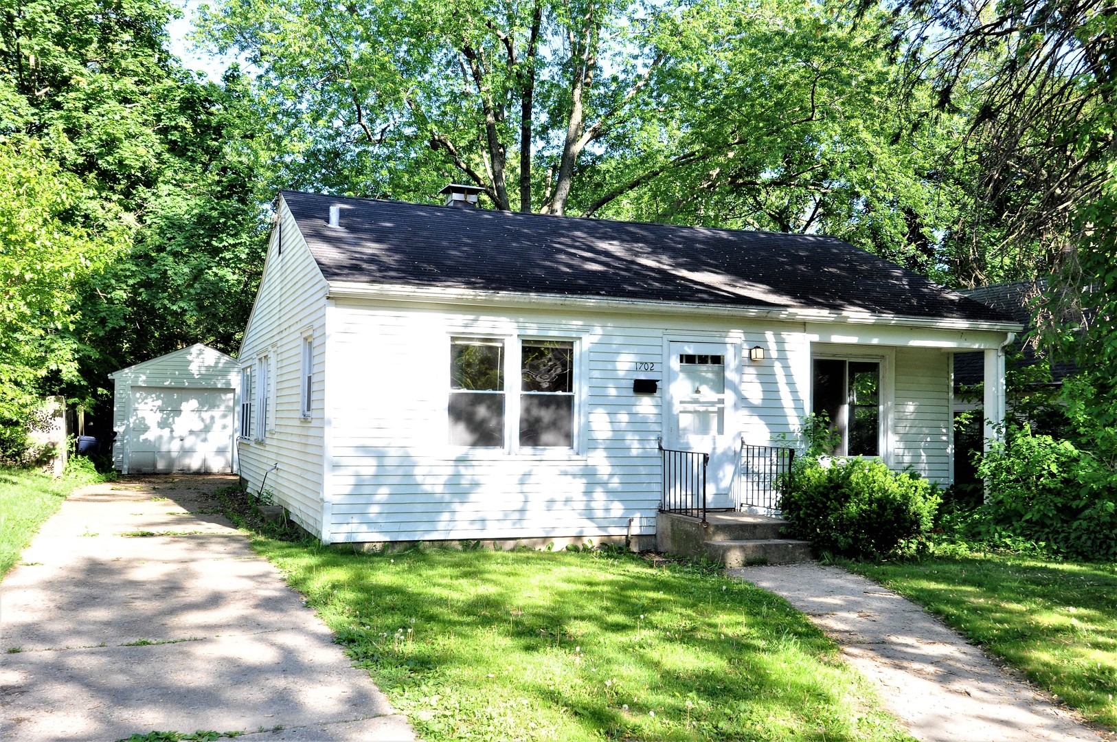1702 Oregon Avenue Rockford, IL 61108 - Photo 1 of 14 a house view with a garden space