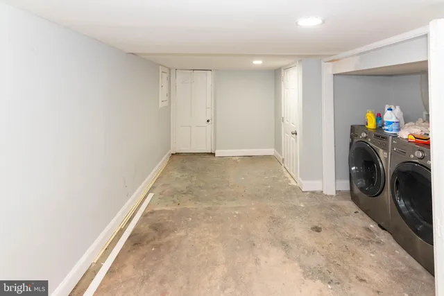 a view of a storage & utility room with washer and dryer