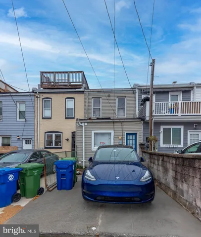 a car parked in front of a house