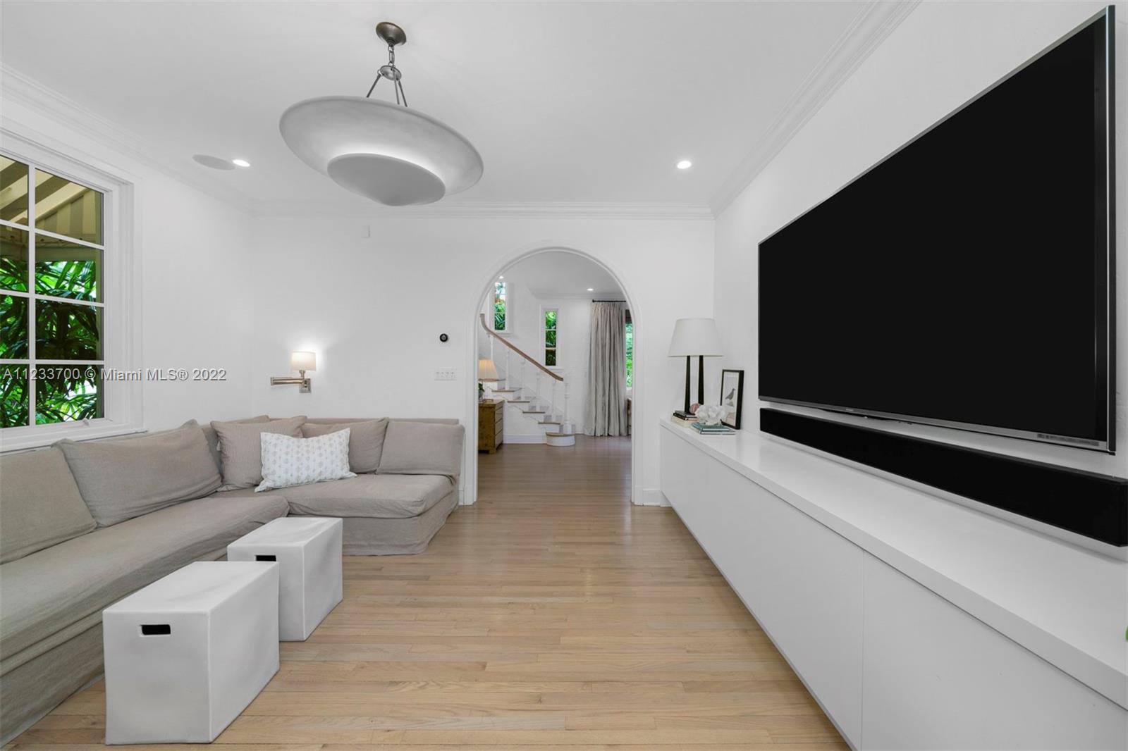 3618 St Gaudens Road Miami, FL 33133 - Photo 11 of 38 a living room with furniture and a flat screen tv