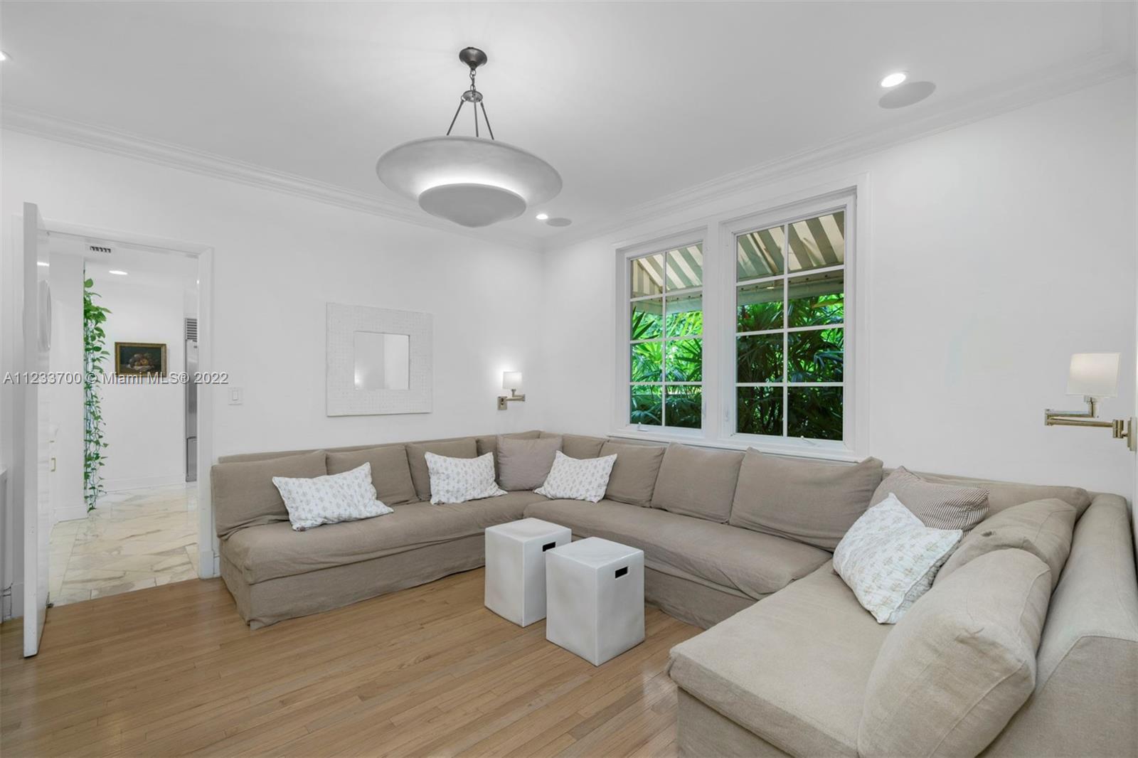 3618 St Gaudens Road Miami, FL 33133 - Photo 12 of 38 a living room with furniture and a large window